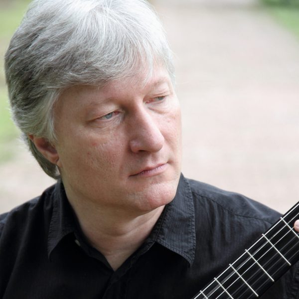 Fabio Zanon plays guitar.