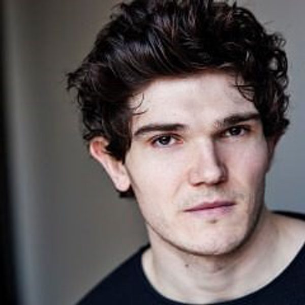 Portrait of Fra Fee looking to camera.