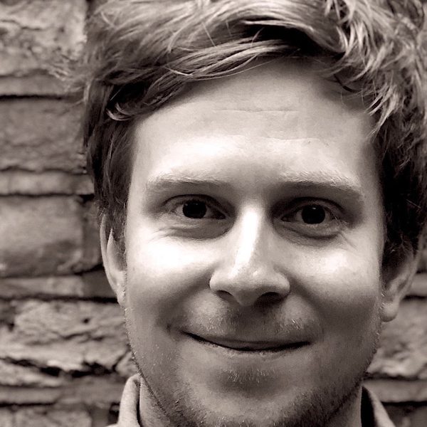 Portrait of Gareth Moorcraft smiling to camera.
