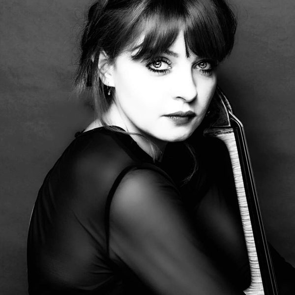 Portrait of Genevieve Brothwood turning to camera (black and white).