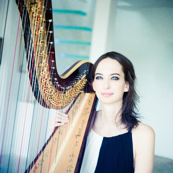 Gwyneth wentink plays a harp.