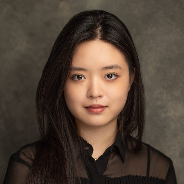 Helen Huang looks to camera.