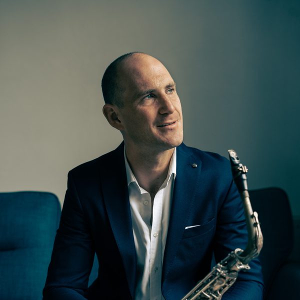 Huw Wiggin holds a saxophone.