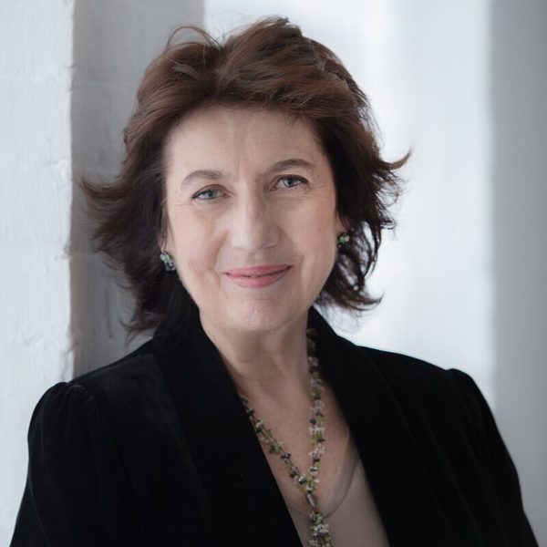 Portrait of Imogen Cooper smiling to camera.