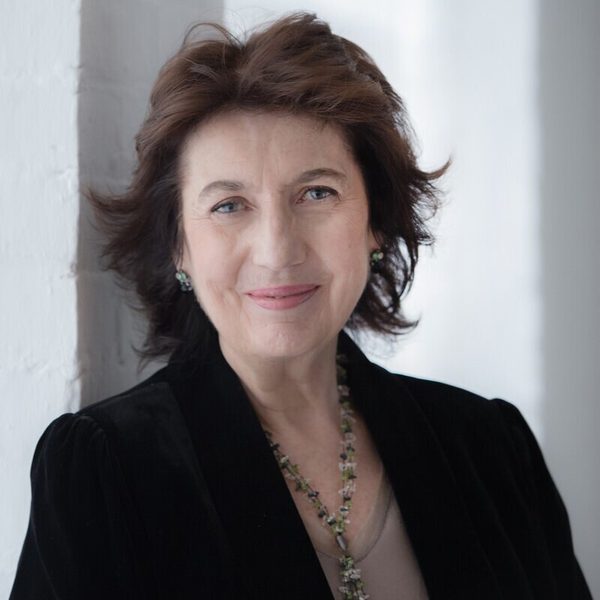 Portrait of Imogen Cooper smiling to camera.