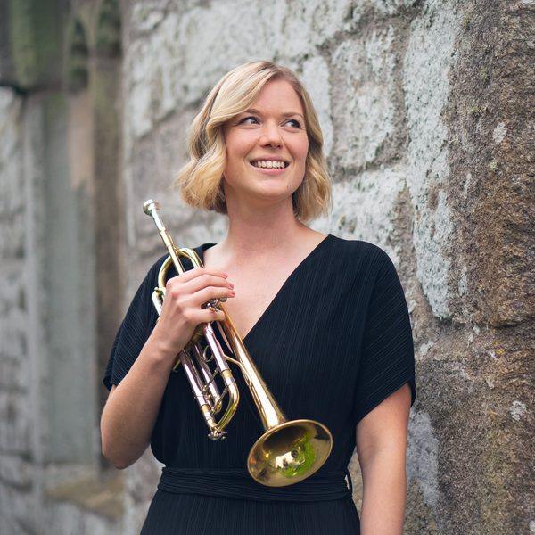 Imogen Whitehead holding a trumpet.
