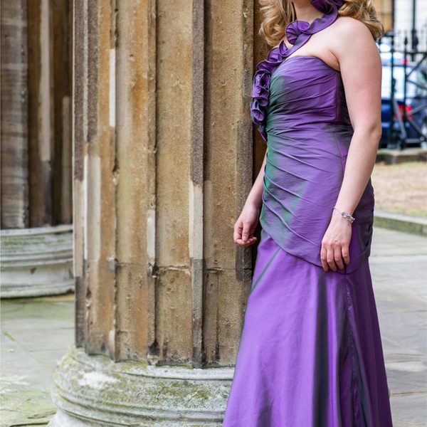 Jocelyn Freeman standing by a building column