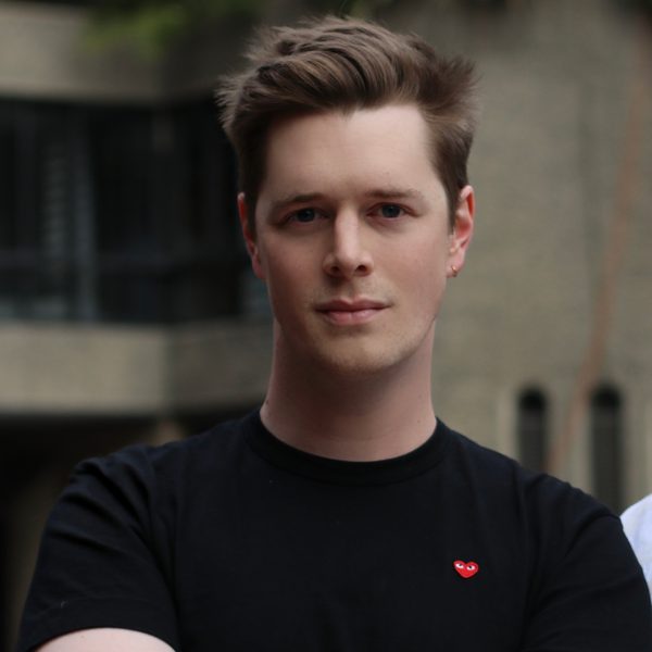 John Lattimore poses with arms folded