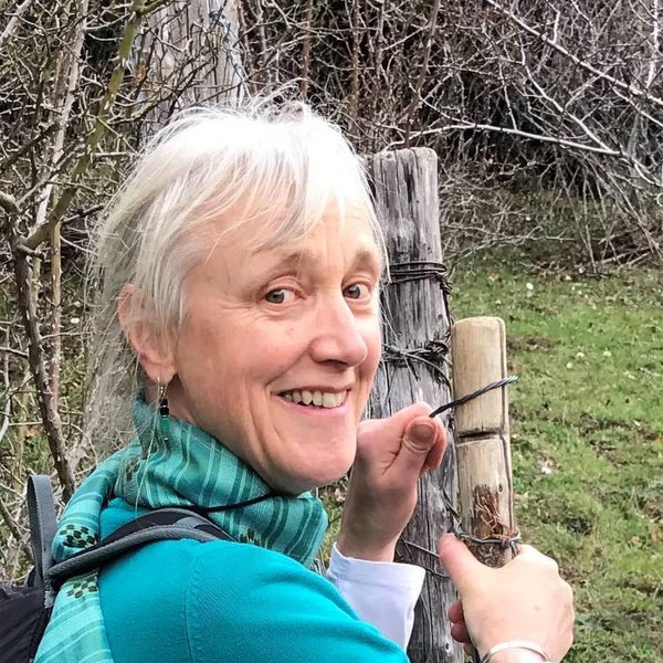 Julia Duschenes outside, smiling.