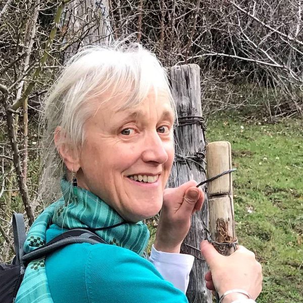 Julia Duschenes outside, smiling.