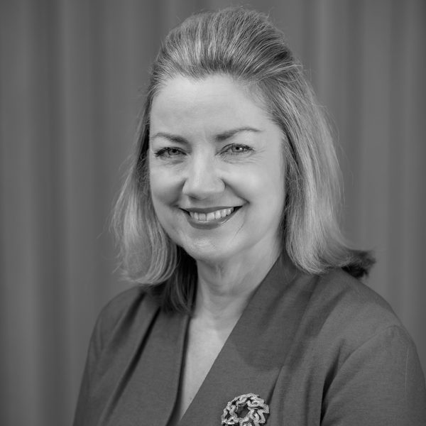 Portrait of Kirsty MacDonald smiling to camera.