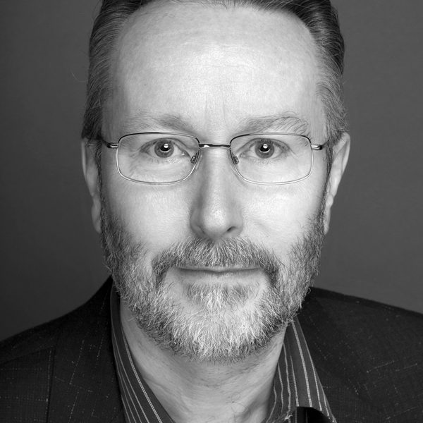 Portrait of Mark Warman looking to camera.