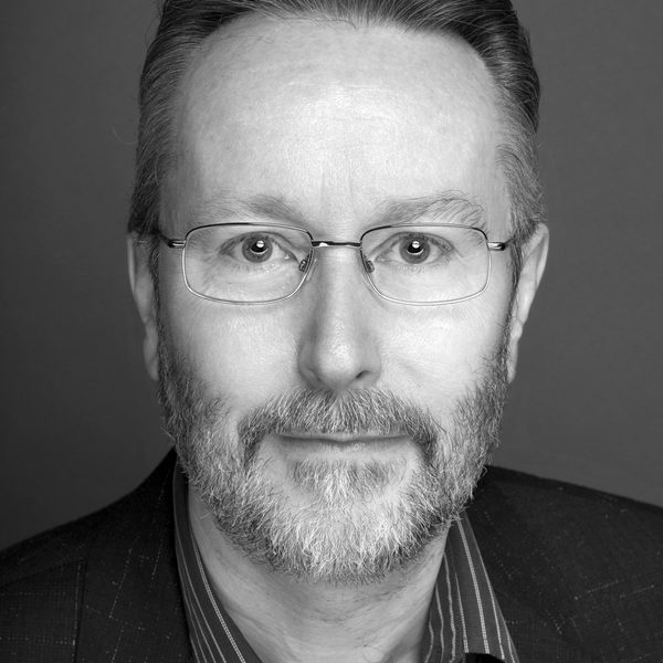 Portrait of Mark Warman looking to camera.