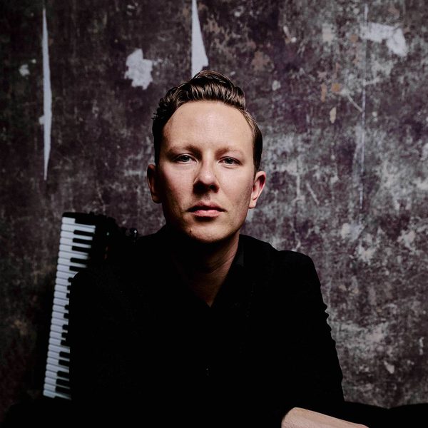 Headshot of Accordionist Martynas Levickis looking to camera.