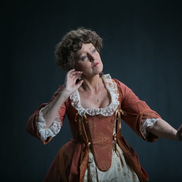 Mary Collins performing on stage.