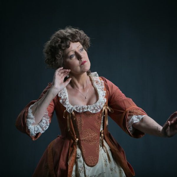 Mary Collins performing on stage.
