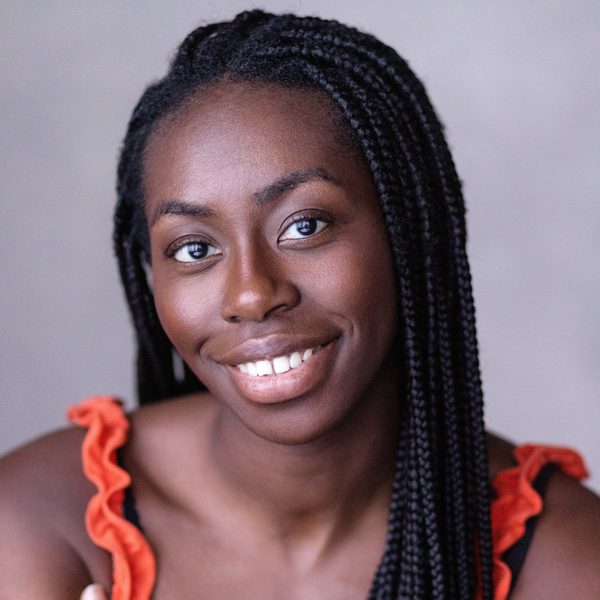 Merryl Ansah smiles to camera.