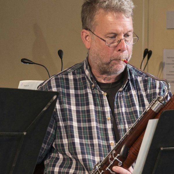Meyrick Alexander plays from sheet music.