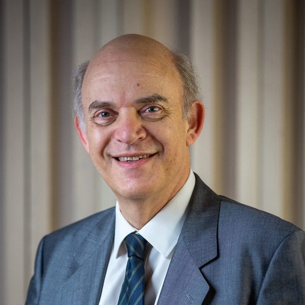 Portrait of Michael Lewin smiling for camera.