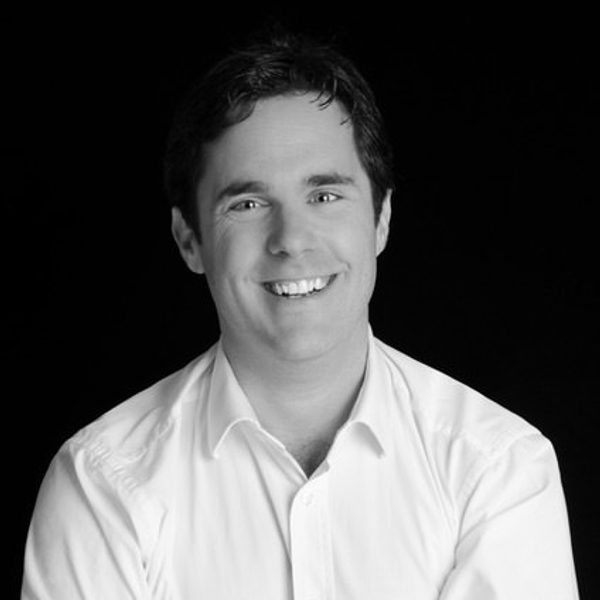 Nicholas mulroy folds arms, looking to camera.