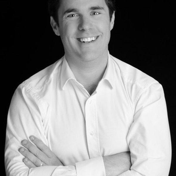 Nicholas mulroy folds arms, looking to camera.