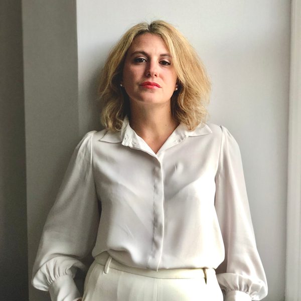 Paola Delucchi looks to camera.