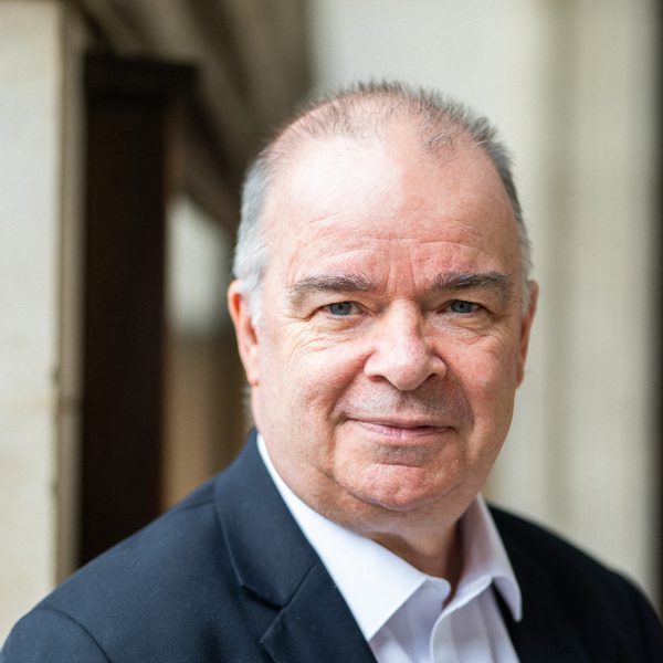 Portrait of Patrick Russill looking to camera.