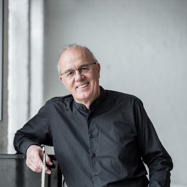 Paul Silverthorne stands for headshot, holding a viola.