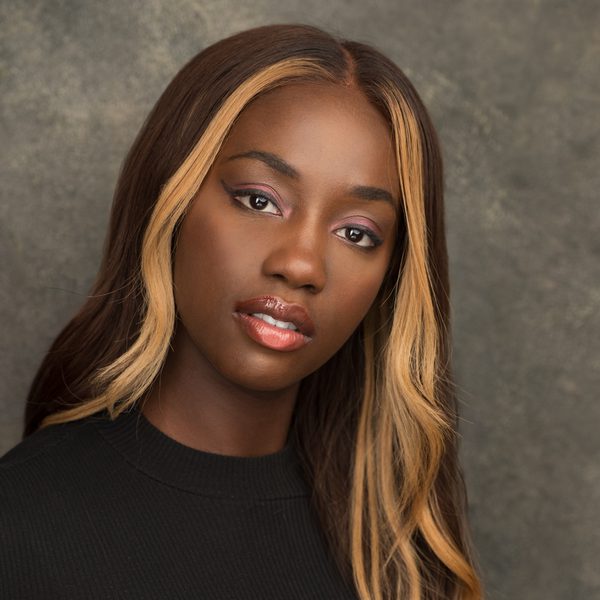 Rachelle Ojomo smiling to camera.