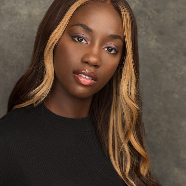 Rachelle Ojomo smiling to camera.
