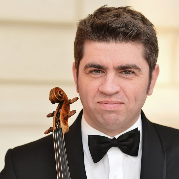 Portrait of Remus Azoiței holding a violin.