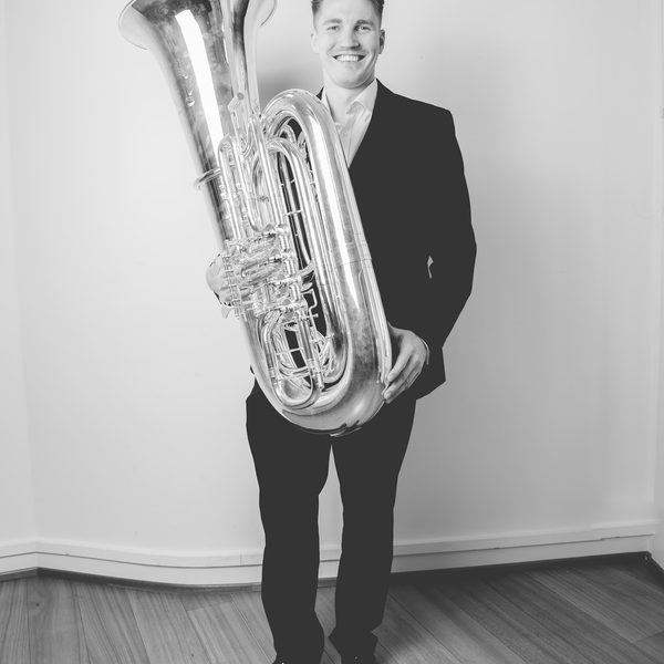 Ross Knight holding a tuba.