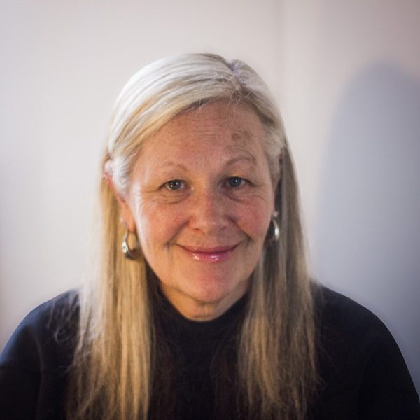 Ruth Byrchmore smiles to camera.