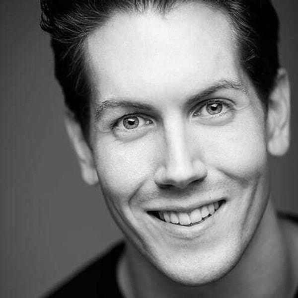 Portrait of Ryan Gover smiling.