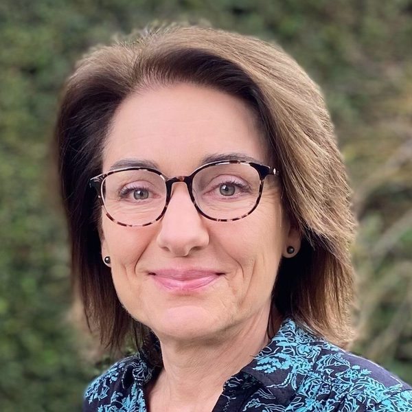 Portrait of Sarah Callis smiling to camera.