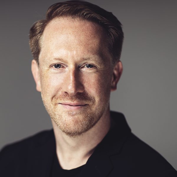 Simon Crawford-Phillips smiling to camera.
