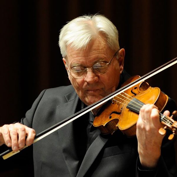 Simon standage plays violin.