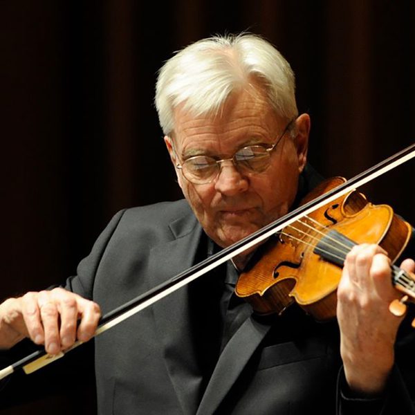 Simon standage plays violin.