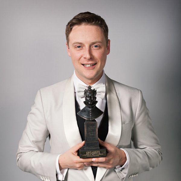 Stephen Ashfield holds an Olivier Award.