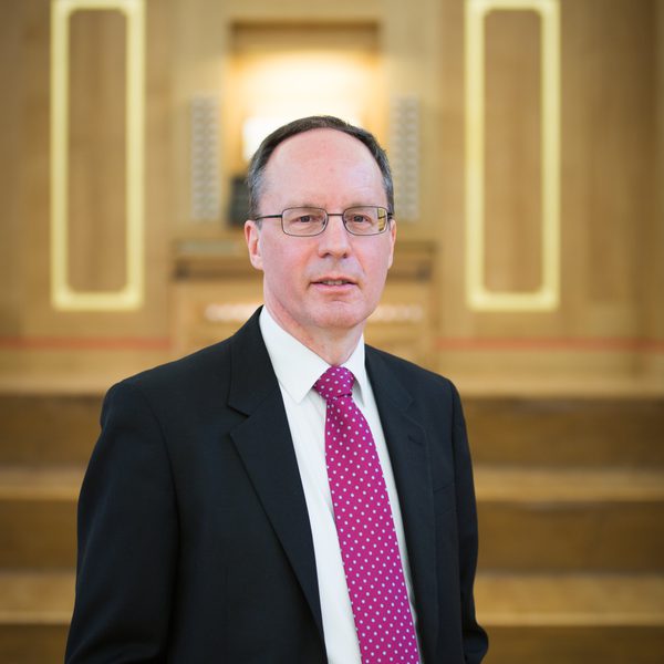 Terence Charlston standing looking into the camera.
