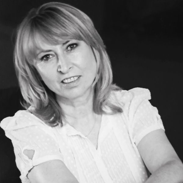 Portrait of Tessa Nicholson looking to camera (black and white).
