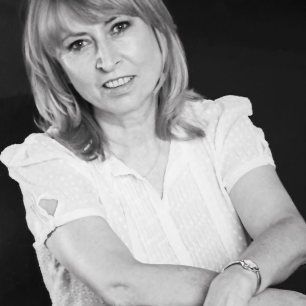 Portrait of Tessa Nicholson looking to camera (black and white).