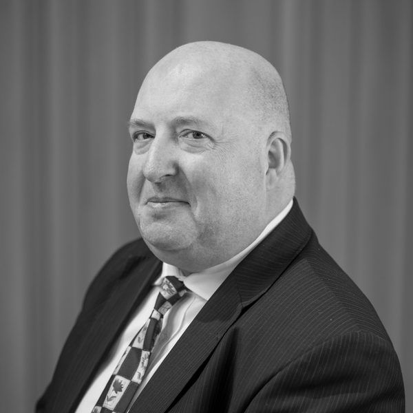 Portrait of Tim Jones looking to camera.